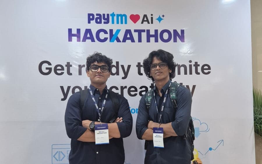 Mohammed Sohel and a teammate in front of the Paytm AI Hackathon banner